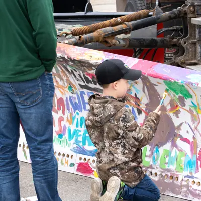 Kid painting snow plow