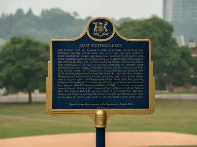 A blue and gold Ontario Heritage Trust plaque for the Galt Football Club stands outdoors with trees and a park landscape in the background.