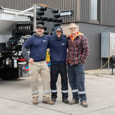 Three public works employees standing for picture