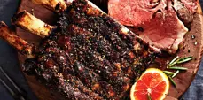 Citrus herb rib roast garnished with herbs and grapefruit 